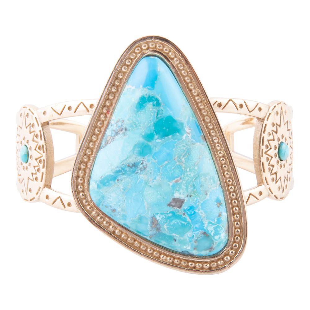Gold bracelet with a large turquoise stone on a white background