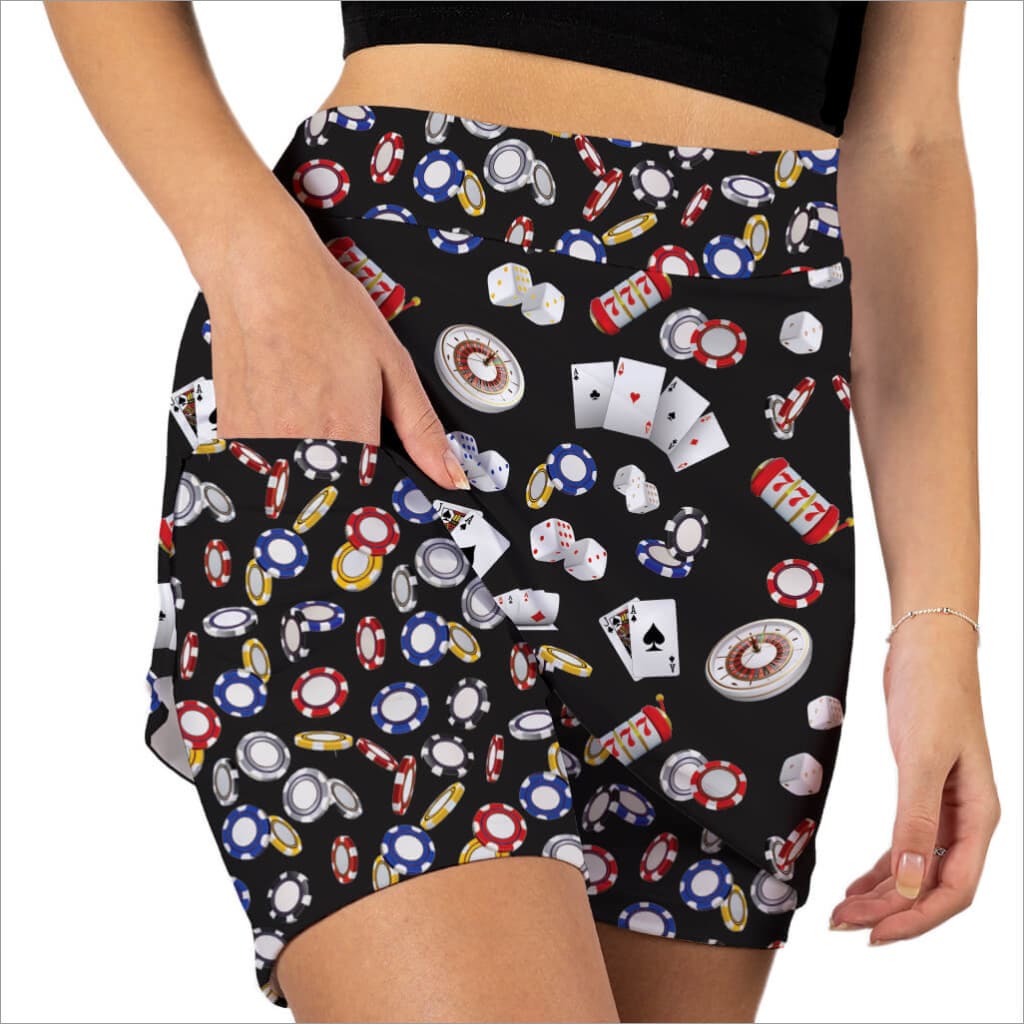 Shorts with a colorful pattern of gaming items on a black background