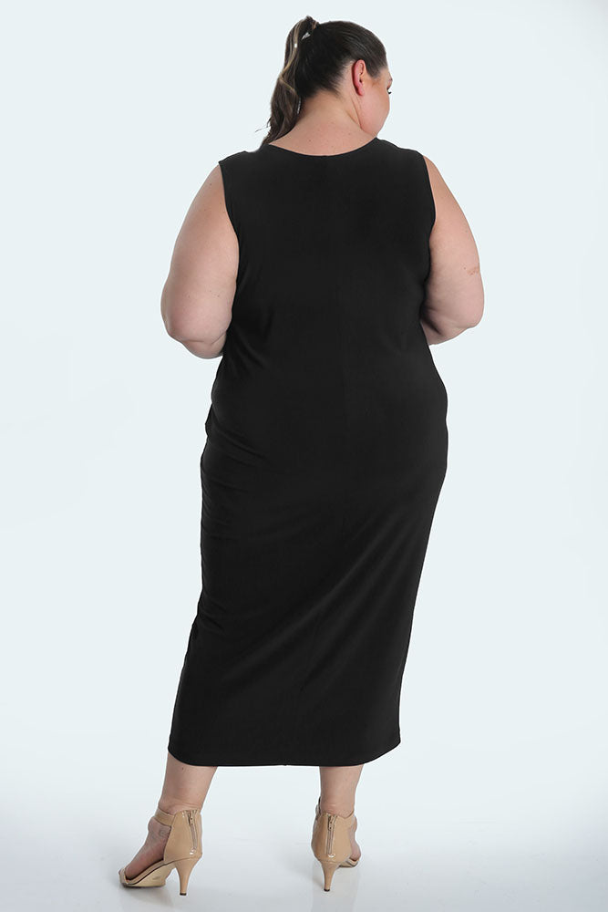 Person wearing a black sleeveless dress on a white background