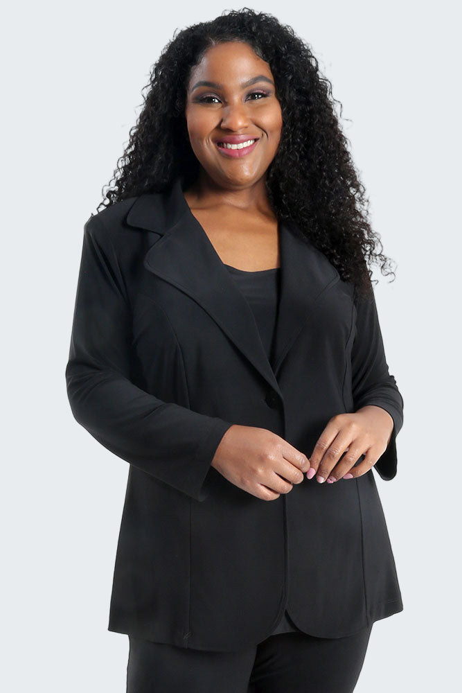 Woman wearing a black suit on a white background