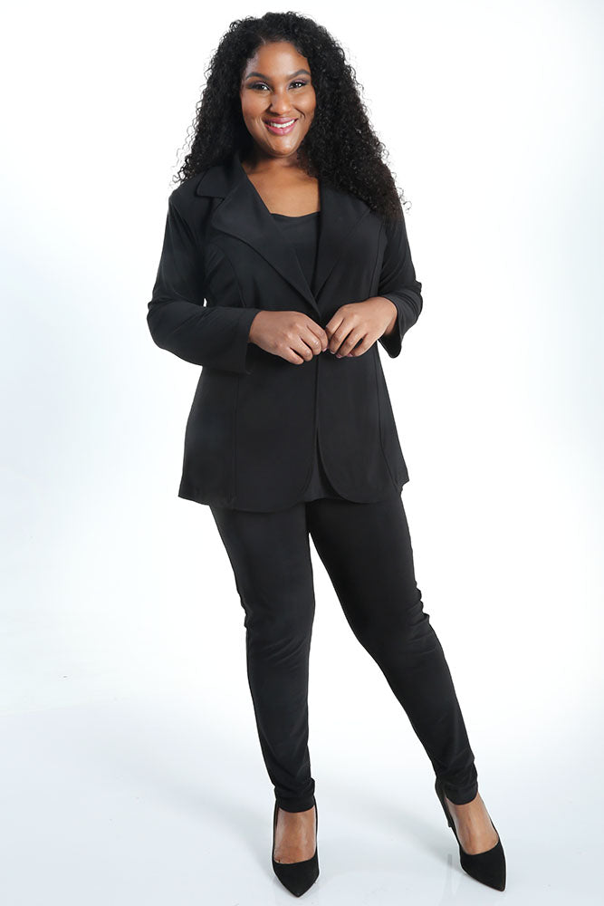 Woman wearing a black suit on a white background