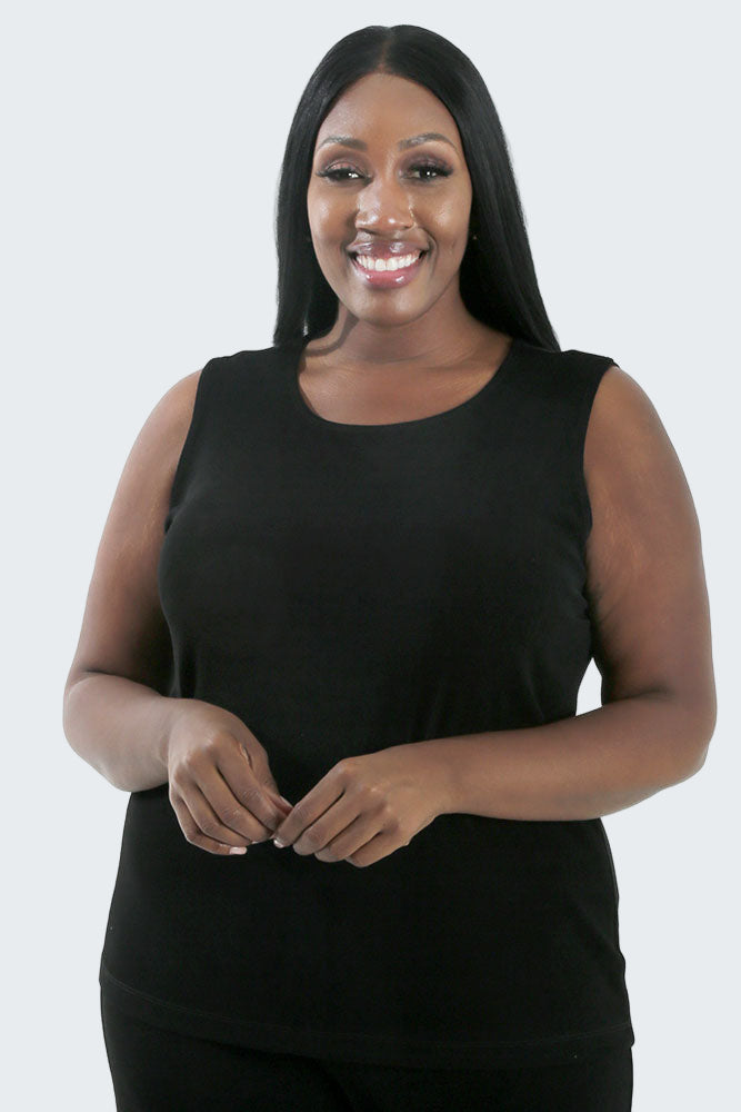 Woman wearing a black sleeveless top on a white background