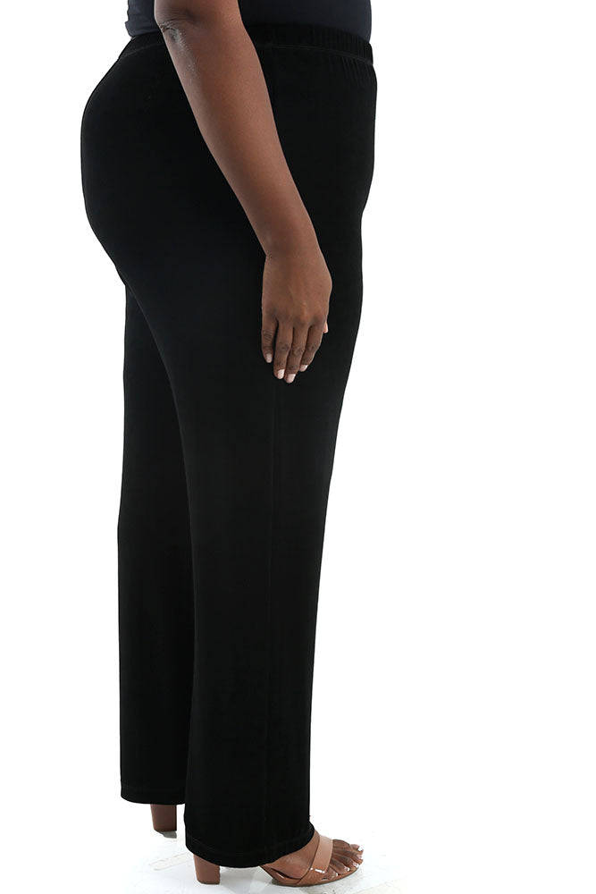Person wearing black pants on a white background