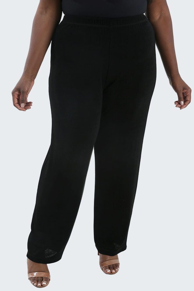 Person wearing black pants on a white background