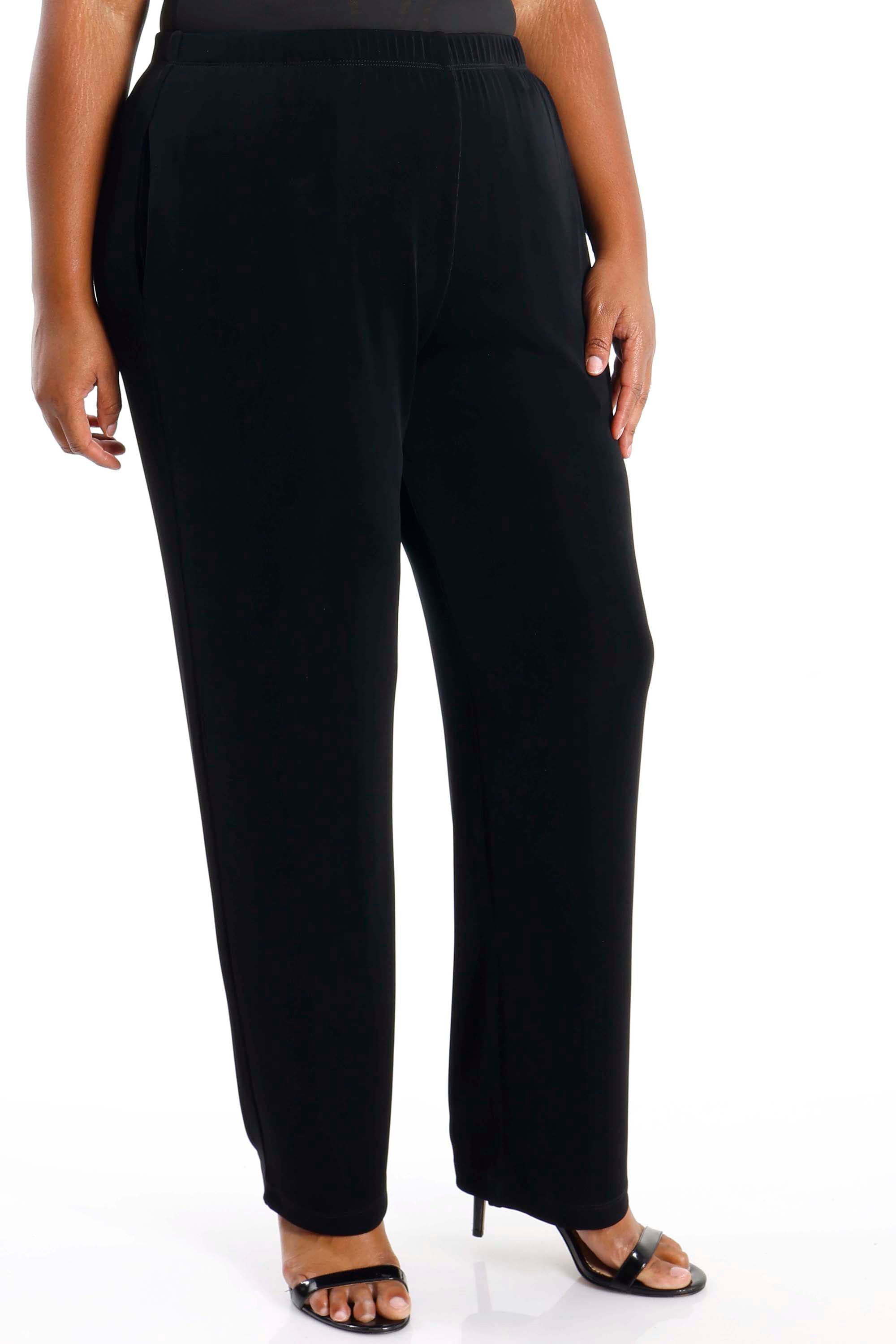 Black pants worn by a person on a white background
