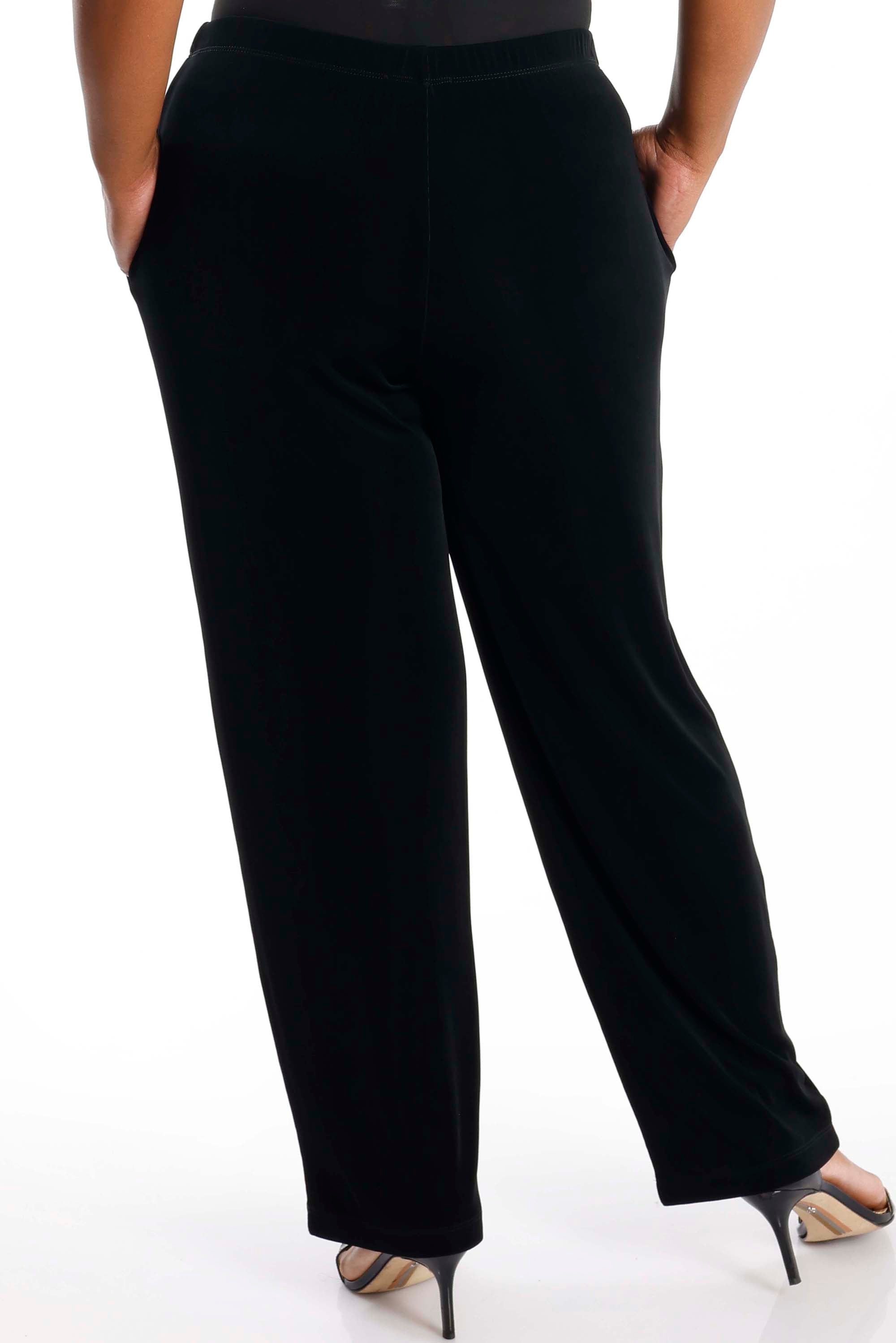 Black pants worn by a person on a white background