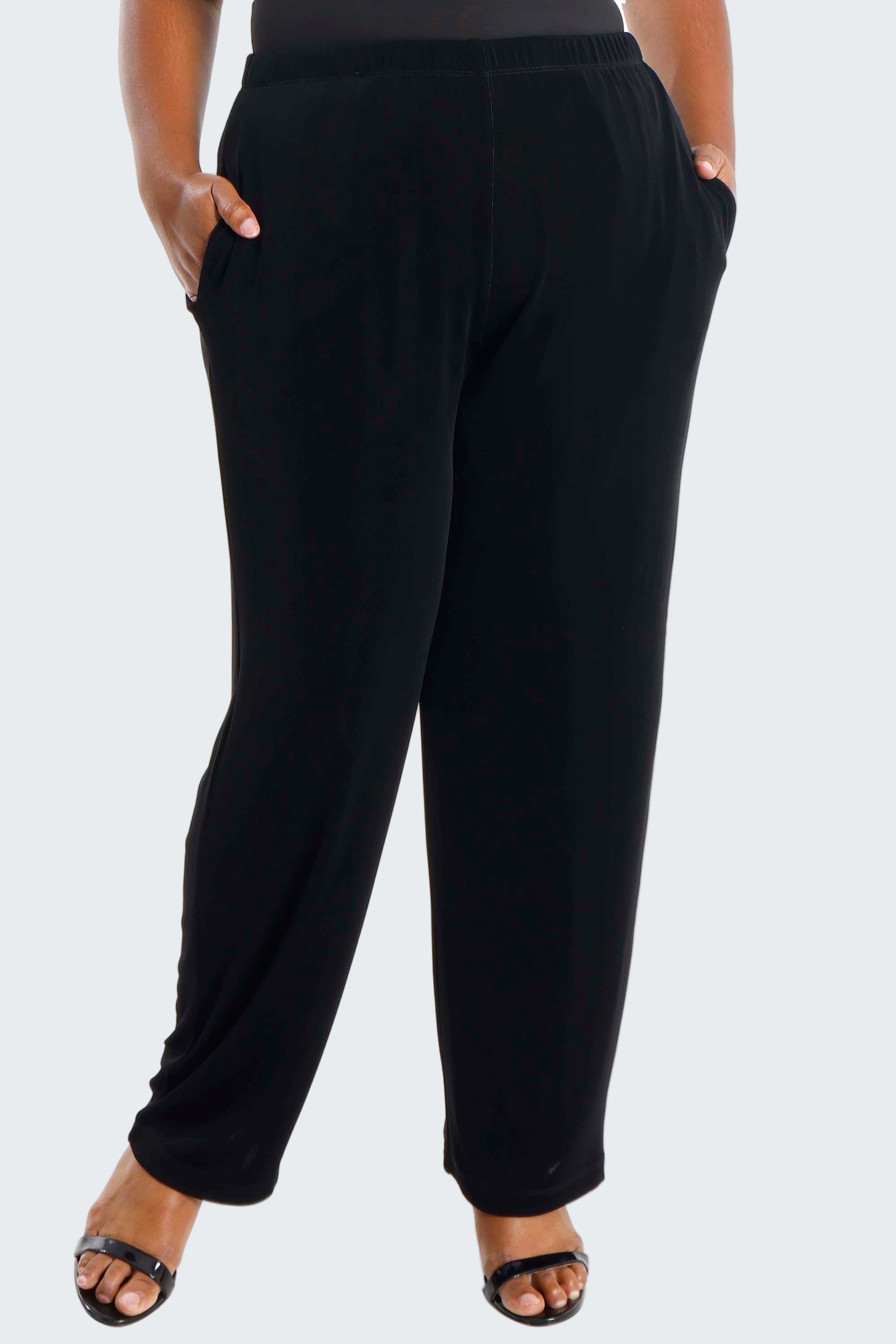 Black pants worn by a person on a white background