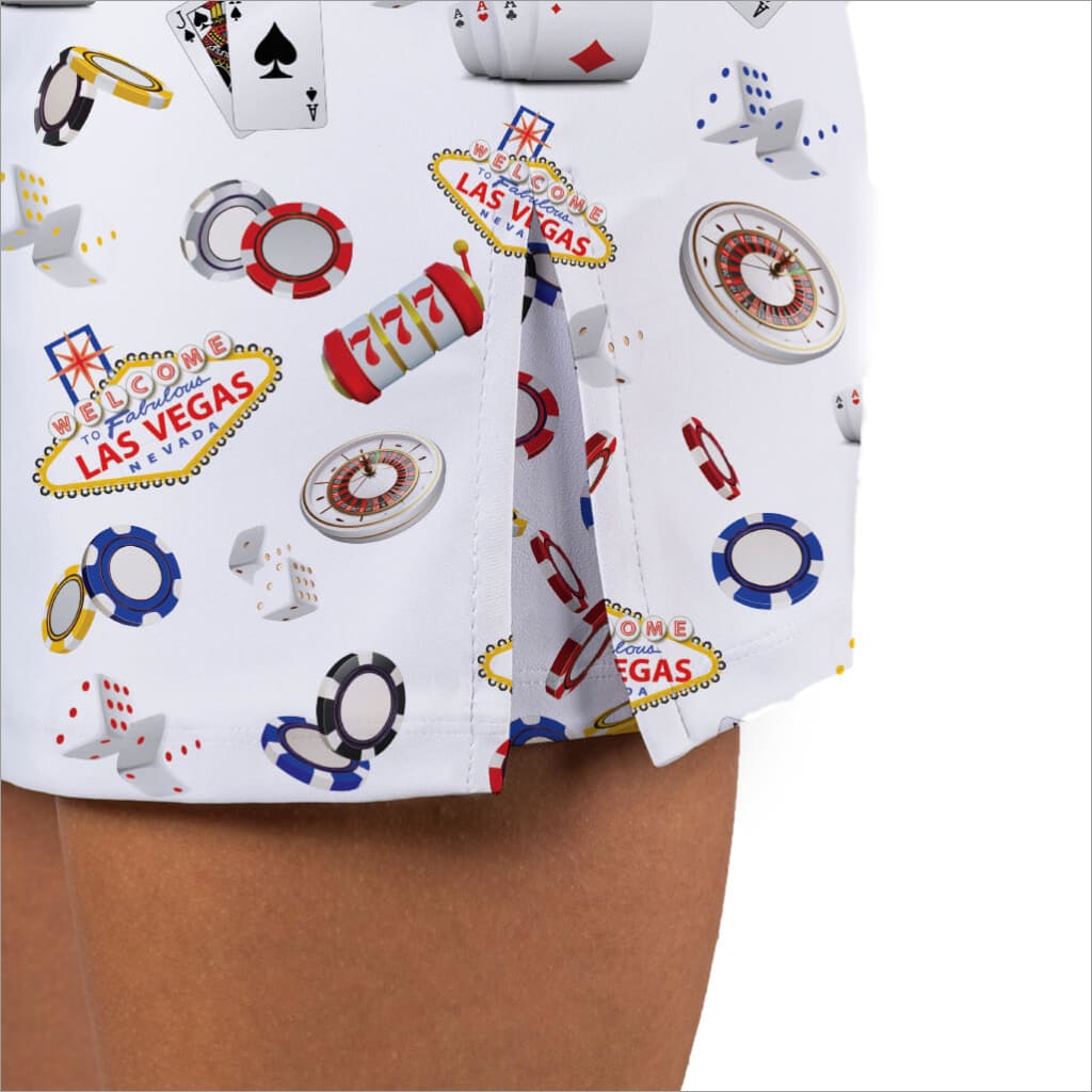 Las Vegas-themed fabric with cards, dice, and roulette wheel patterns on a white background.