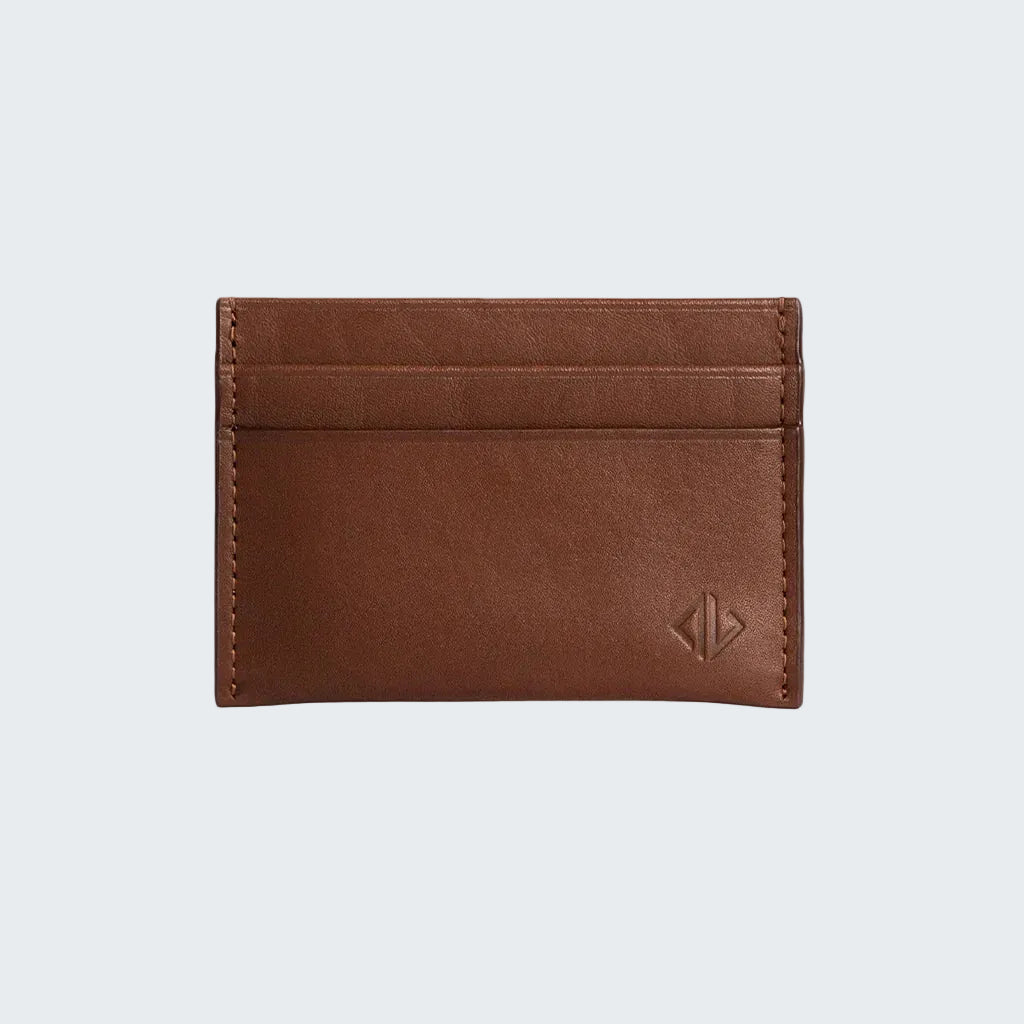Brown leather cardholder with a visible brand logo on a white background