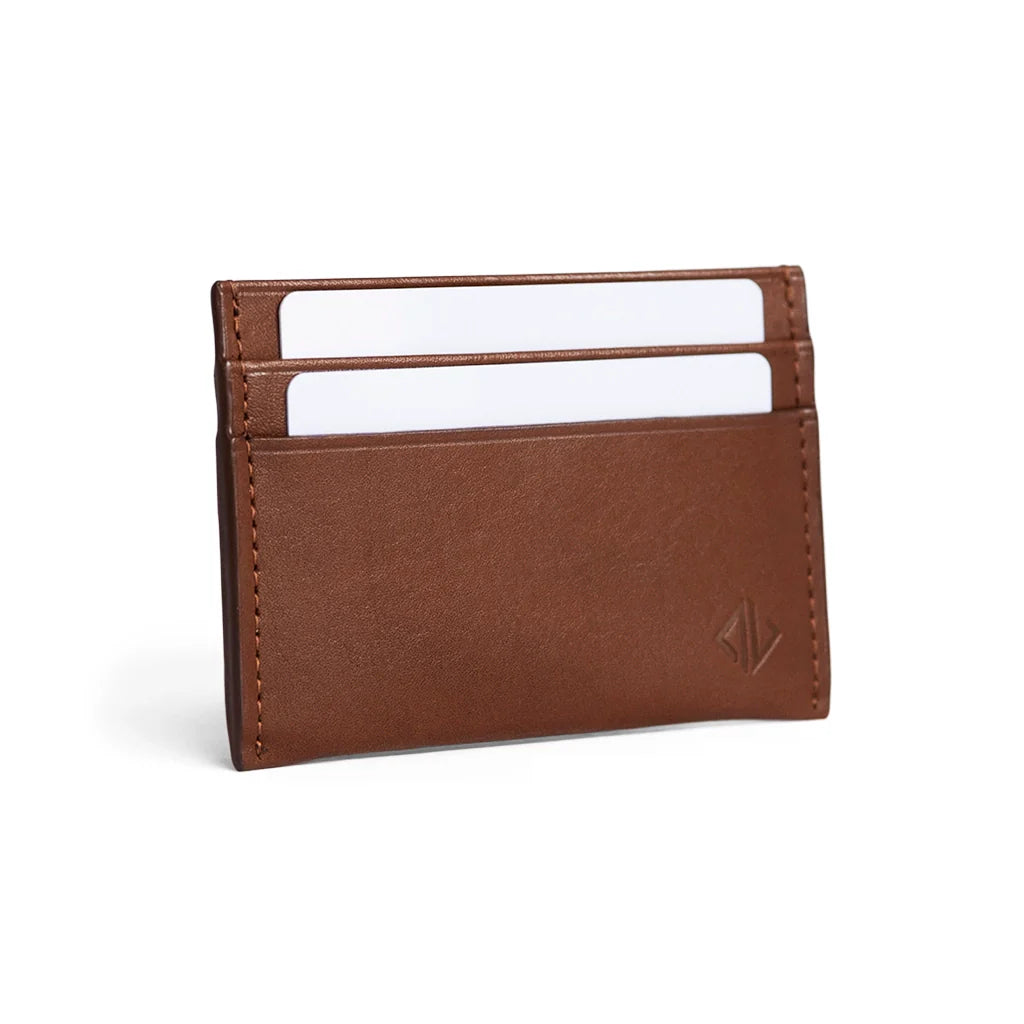 Brown leather cardholder with white cards on a white background