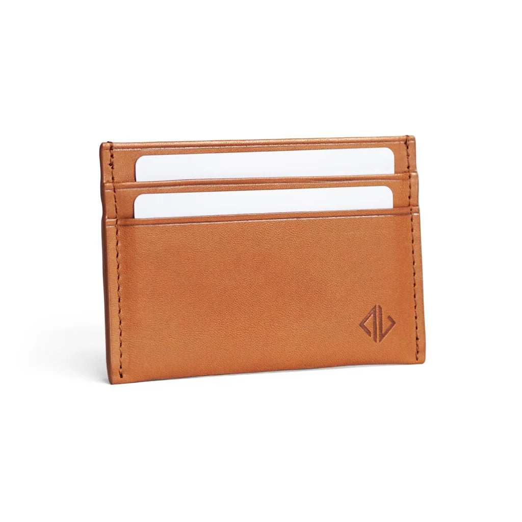 Brown leather cardholder with white cards on a white background