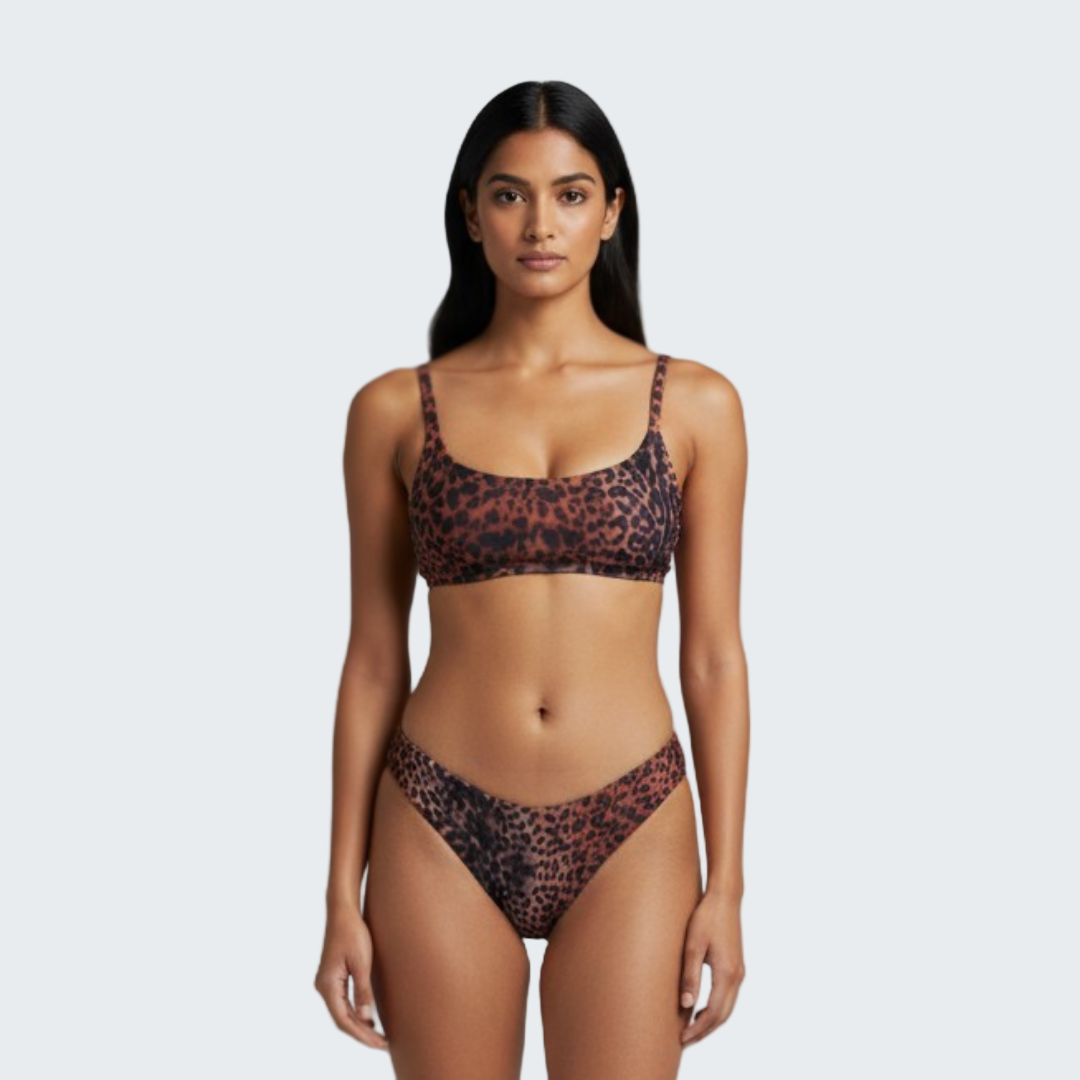 Woman wearing a leopard print bikini against a gray background