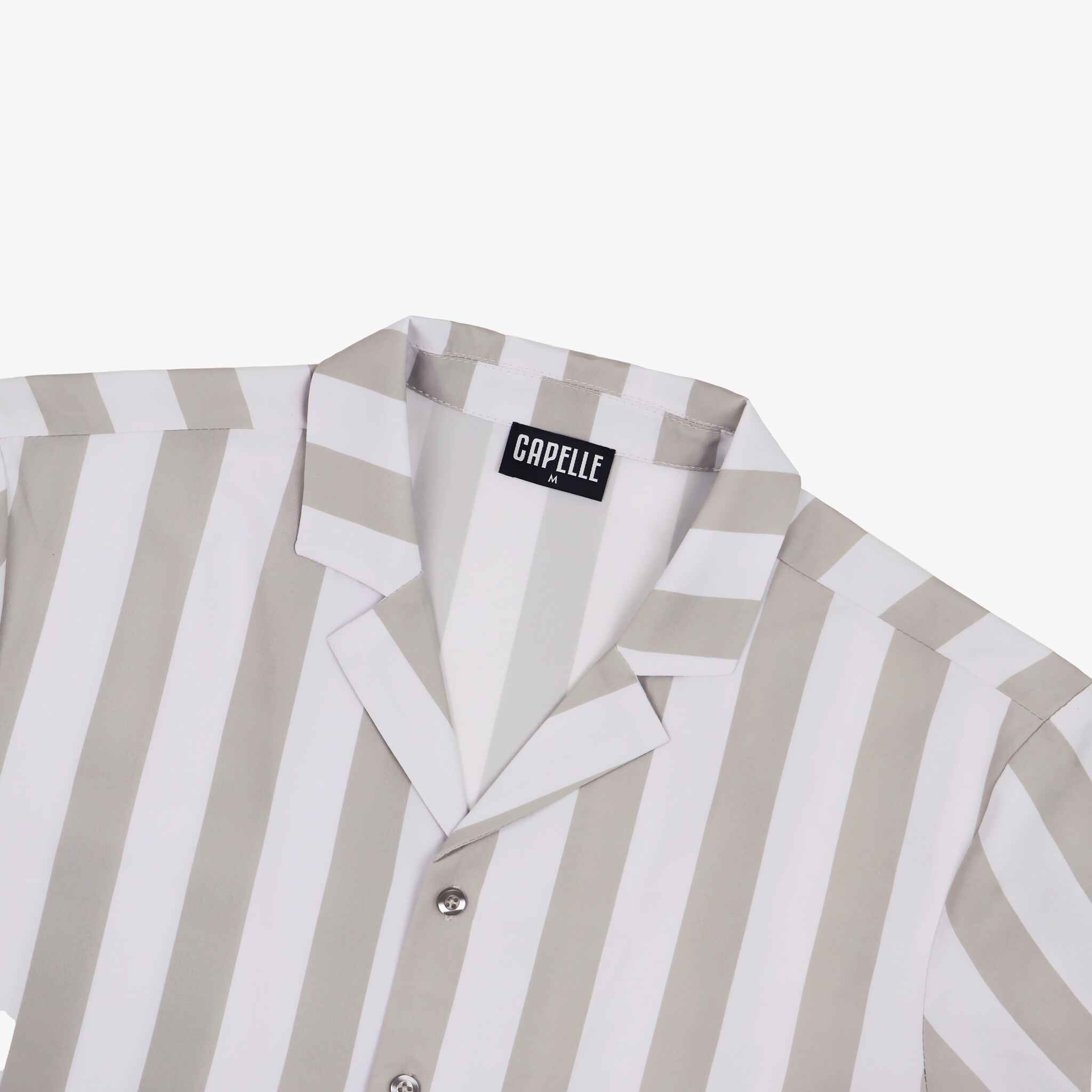 Striped shirt with a visible brand label on a white background