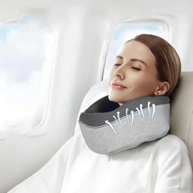 Woman using an inflatable neck pillow on a plane
