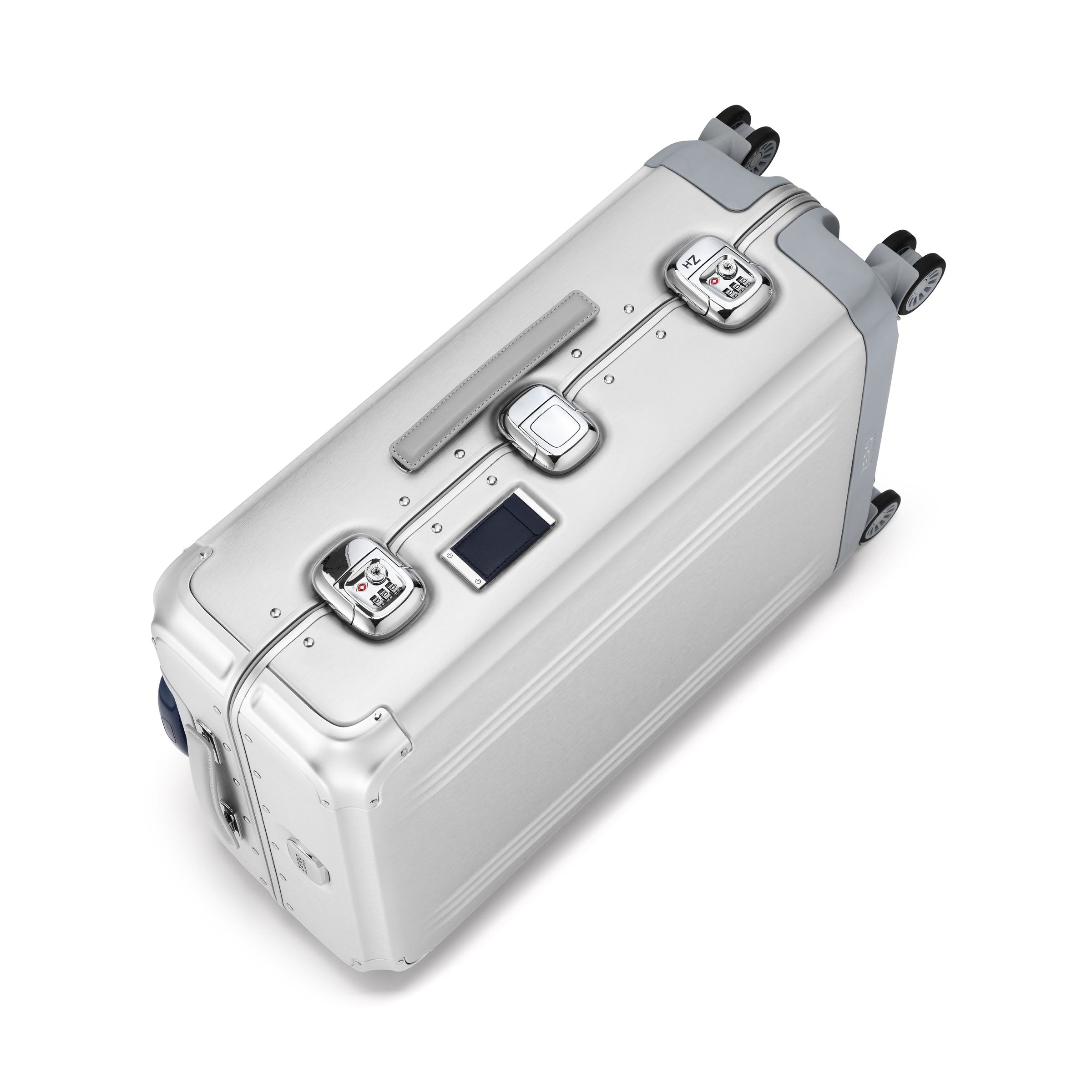 Silver suitcase with multiple handles and wheels on a white background