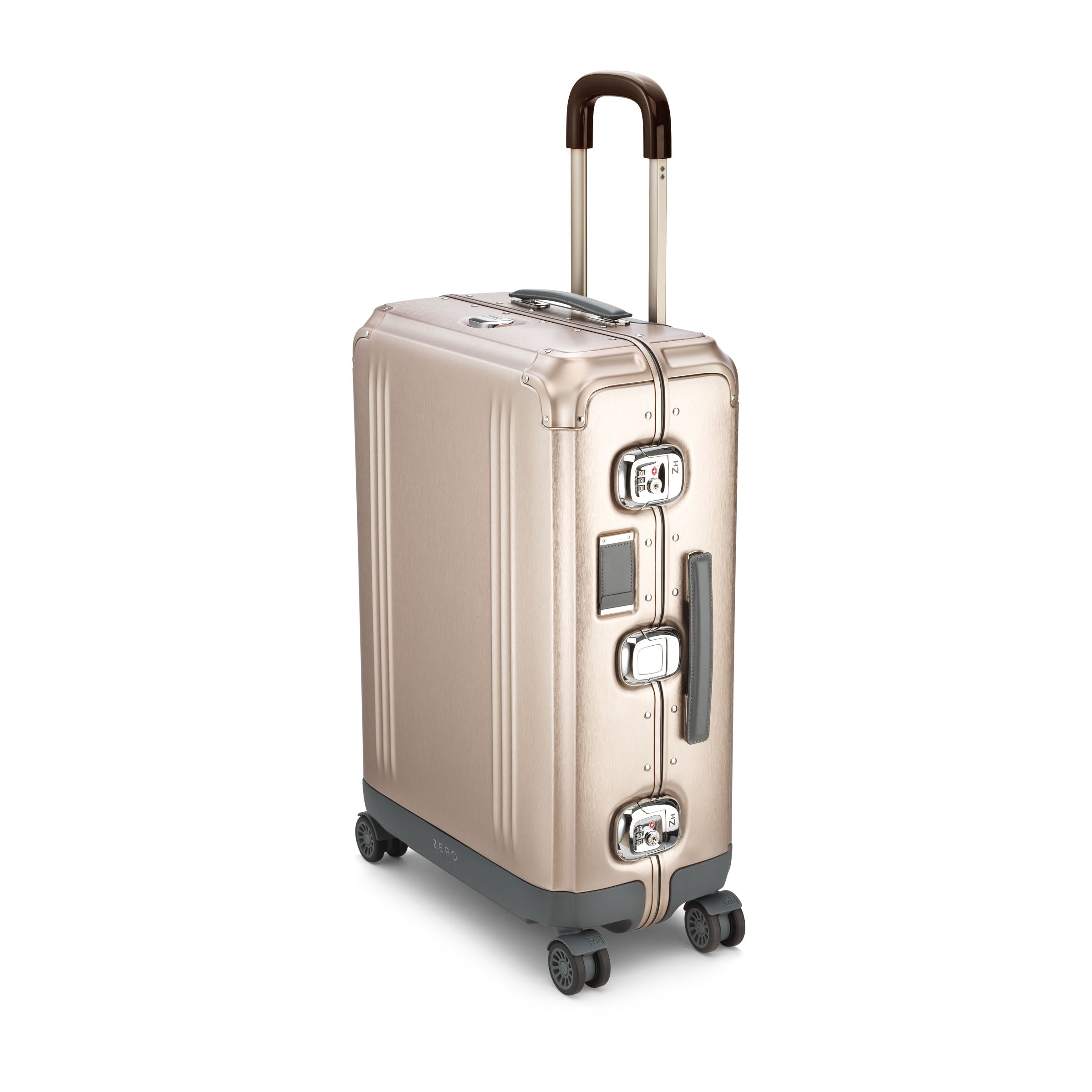Gold suitcase with wheels and handle on a white background