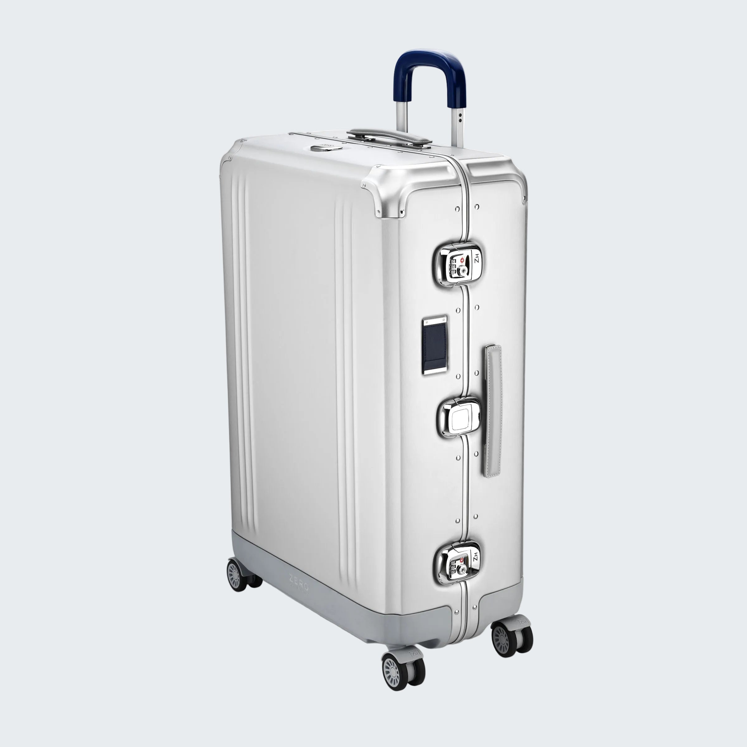 Silver suitcase with wheels and a handle on a white background