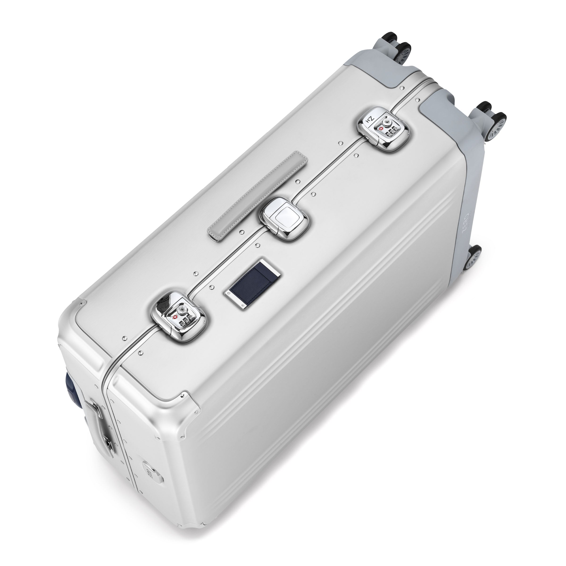 Silver suitcase with multiple handles and wheels on a white background