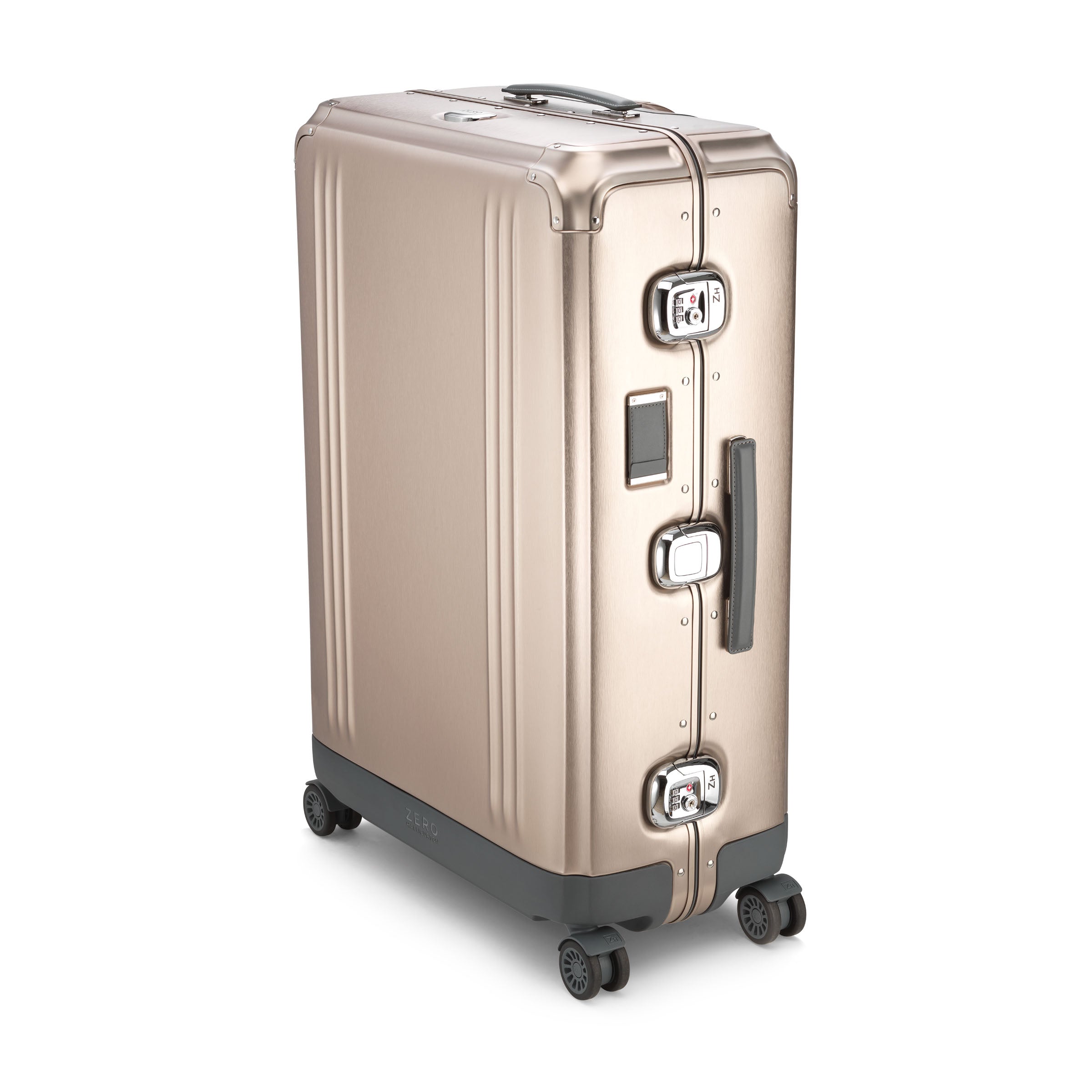 Gold suitcase with wheels and handle on a white background