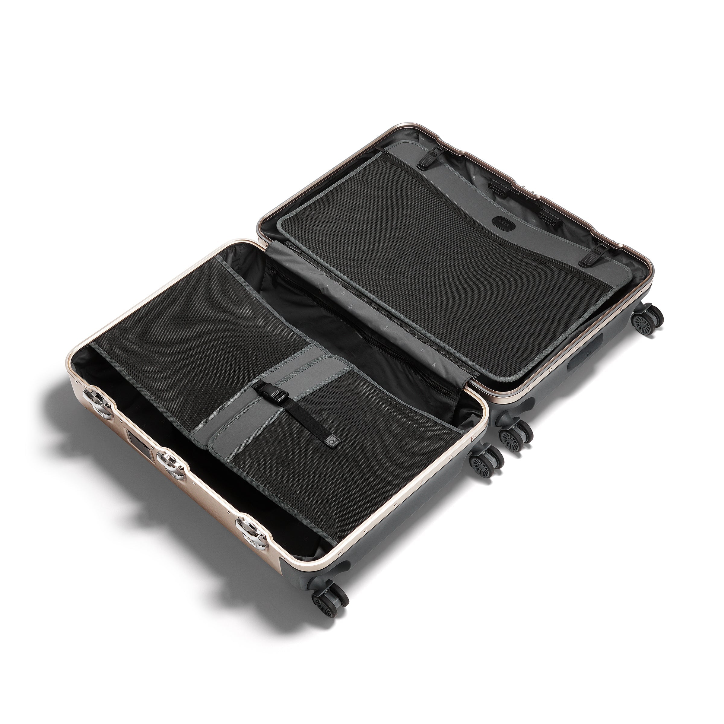 Open suitcase with black interior on a white background