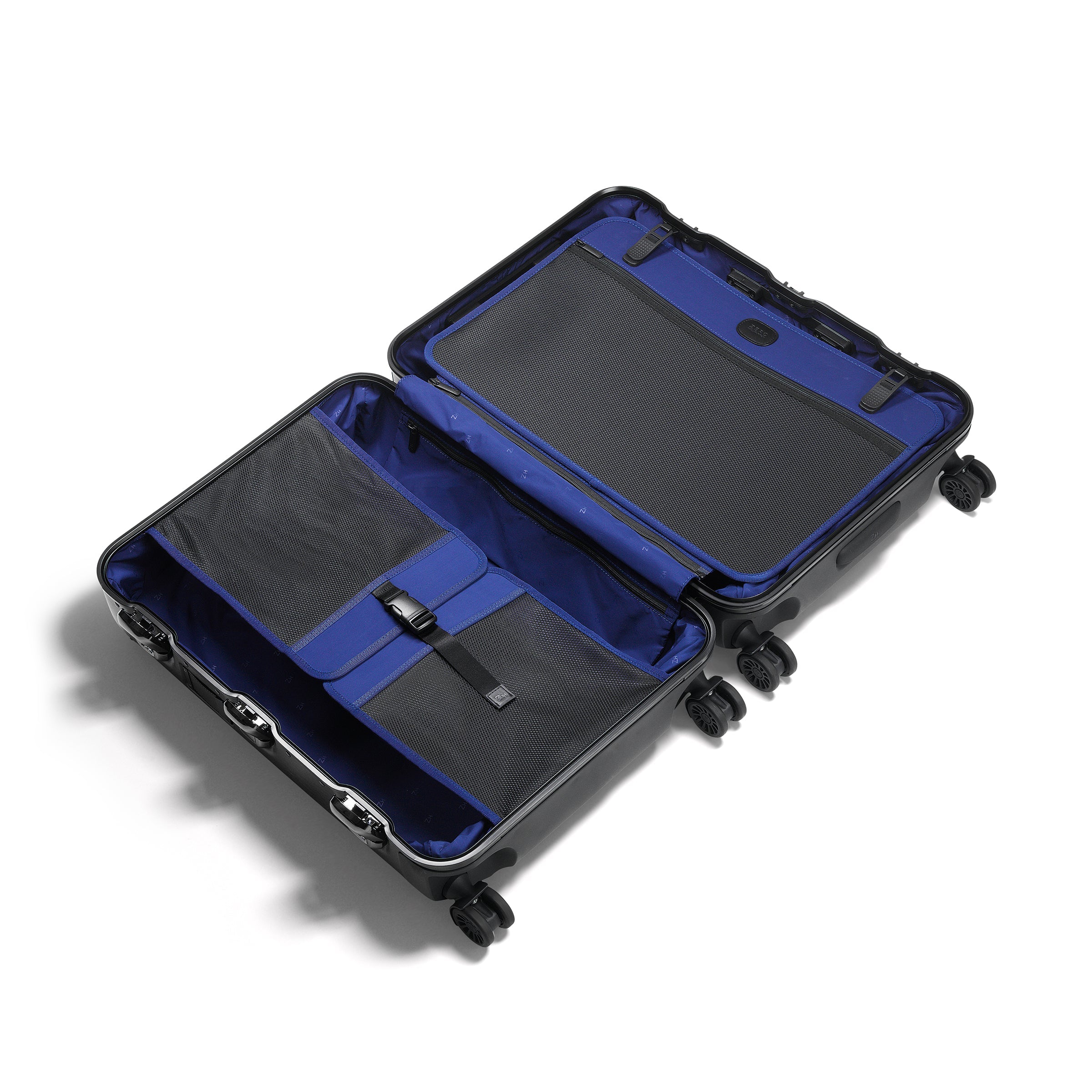 Open suitcase with blue interior on a white background