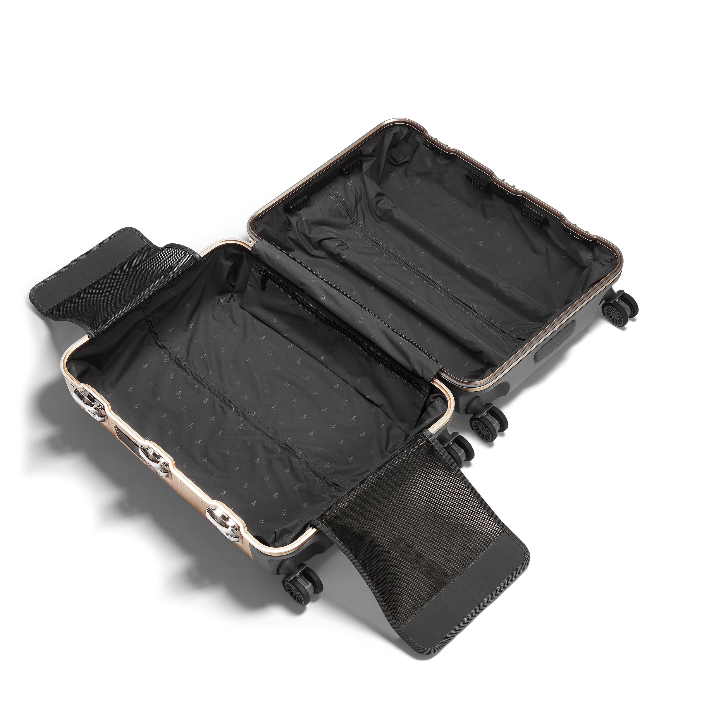Open black suitcase with gold accents on a white background