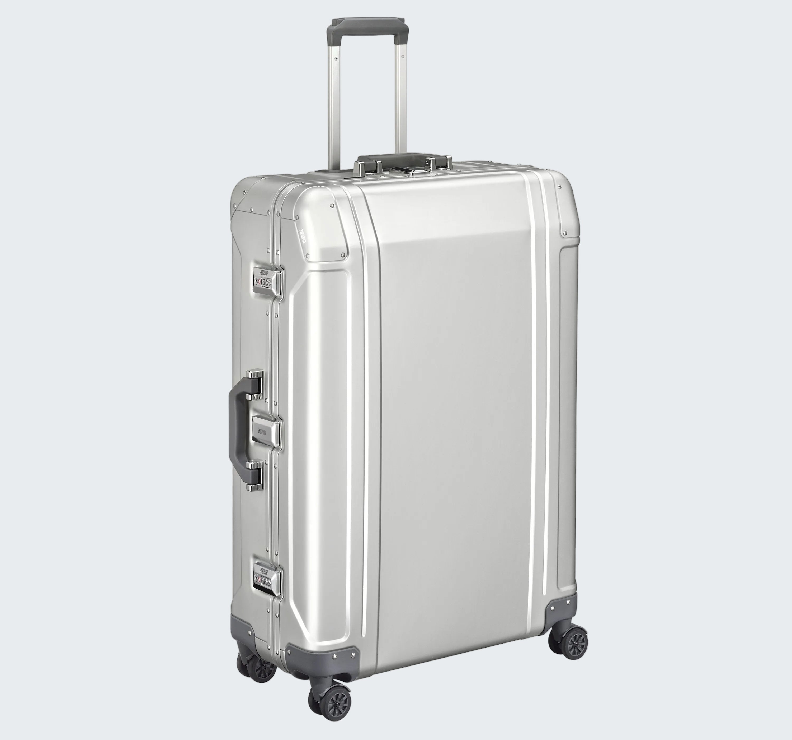 Silver suitcase with wheels and handle on a white background