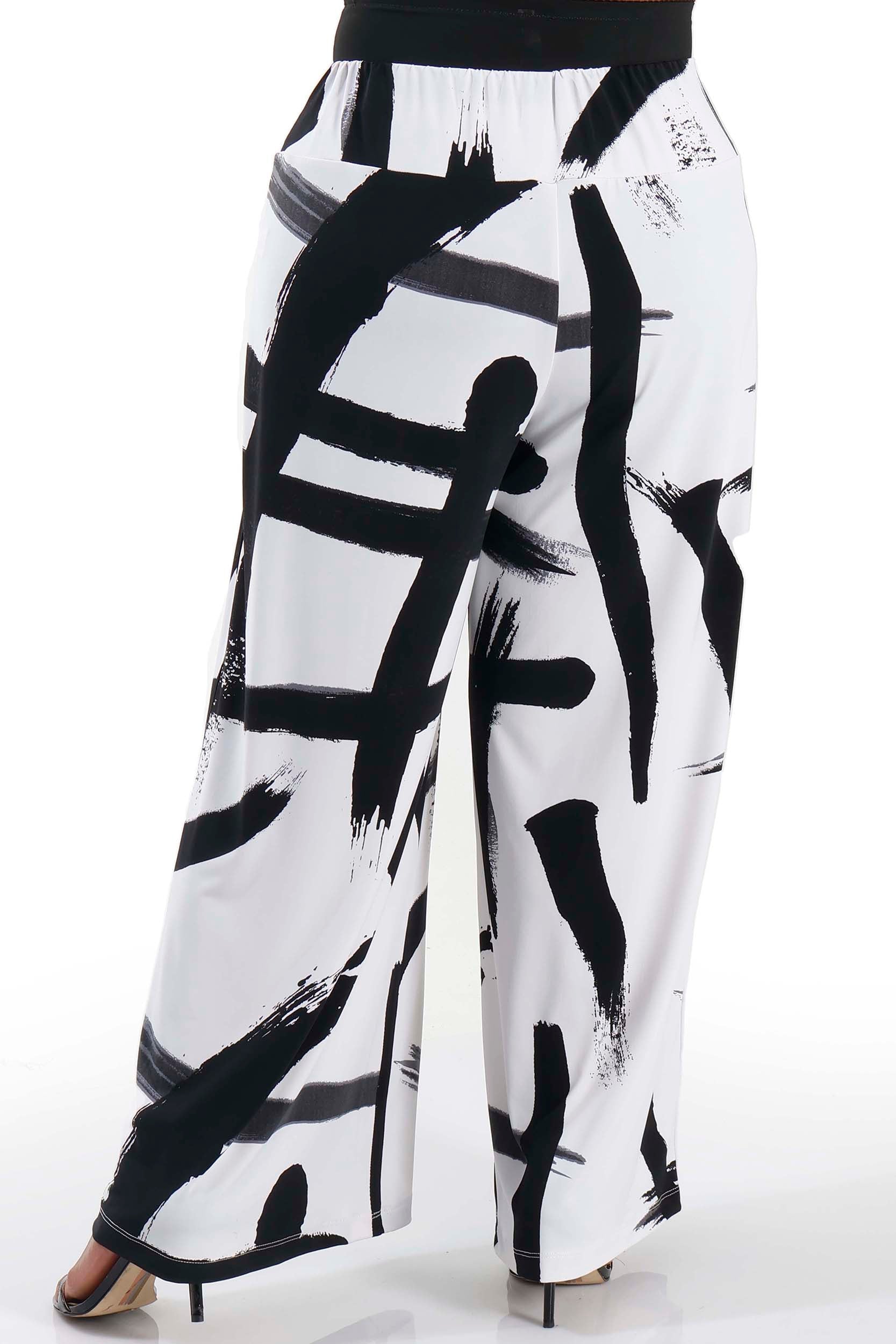 White pants with black abstract brushstroke pattern on a white background